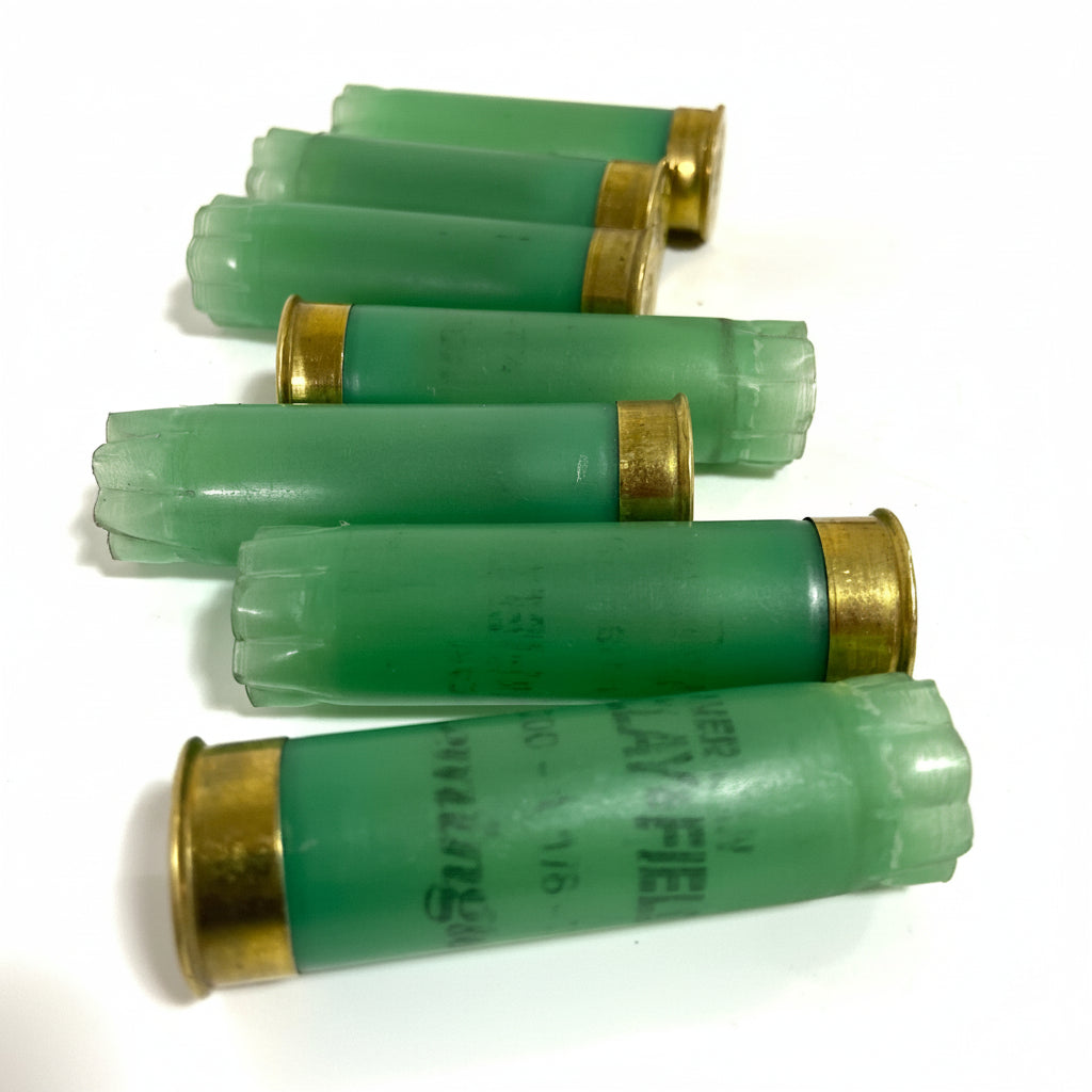 Light Green Remington Clay Field 12 Gauge spent Hulls In A Row