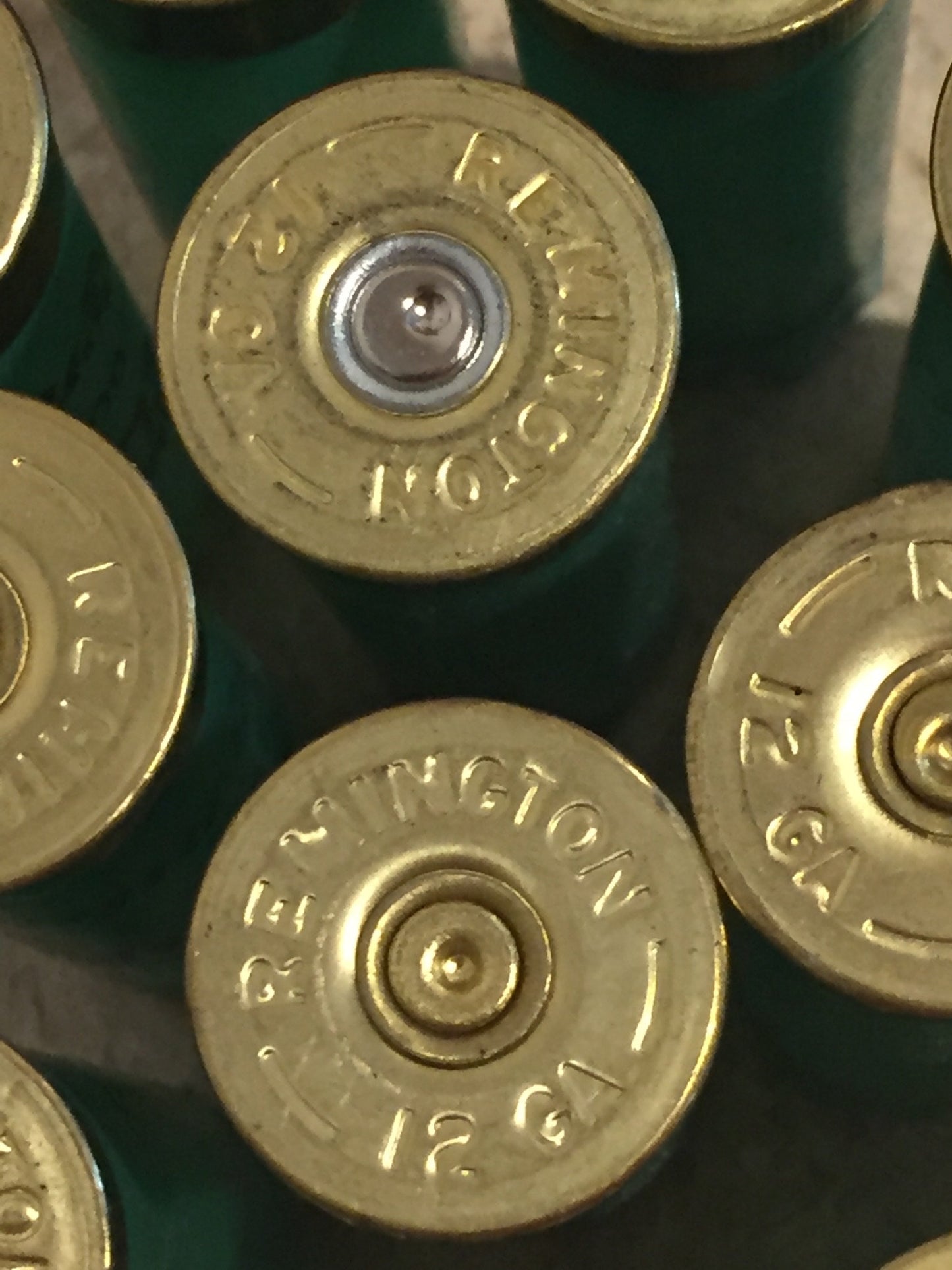 Remington 12 Gauge Headstamp Close Up On Light Green Hulls