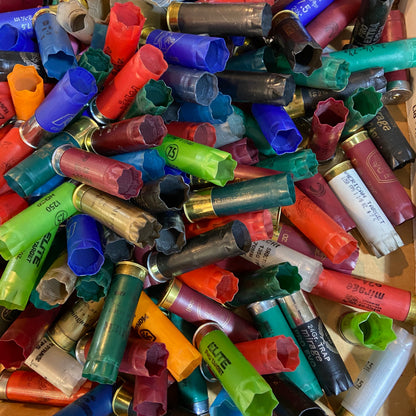 Top-down view of multi-colored 12ga shells. Inert 12ga shells for crafts (no powder/primers).
