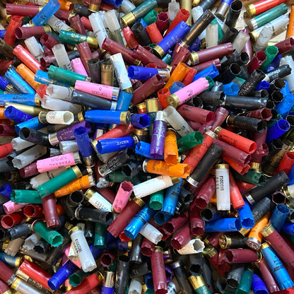 Large assortment of once-fired 12 gauge hulls in red, blue, green, orange, pink, and other colors