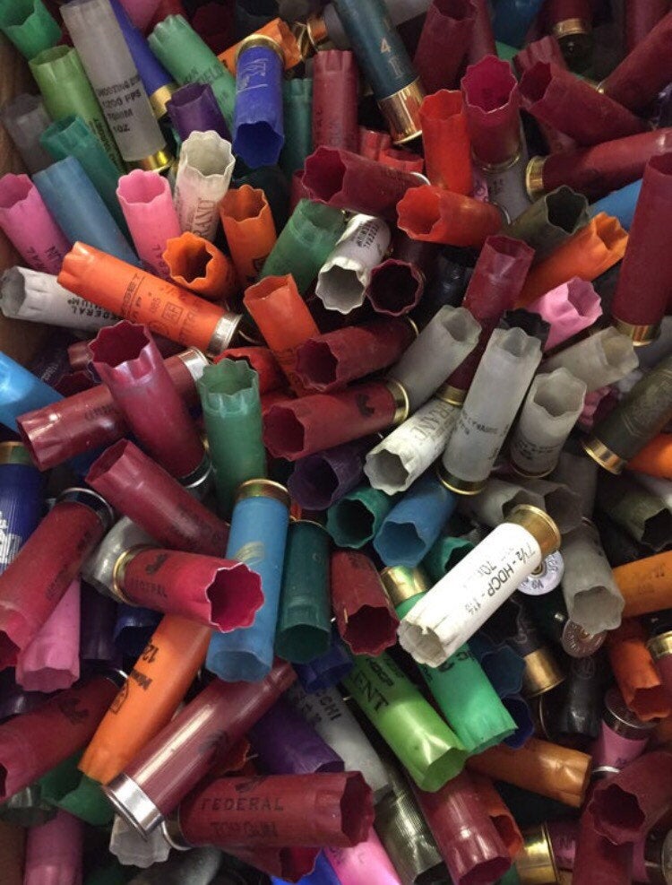 Close-up of colorful used 12 gauge shotgun hulls with open crimped ends