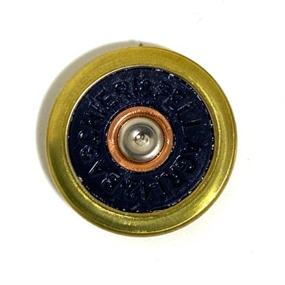 Close-up of a navy blue Baschieri & Pellagri 12 gauge shotgun shell slice with a brass rim, viewed from above