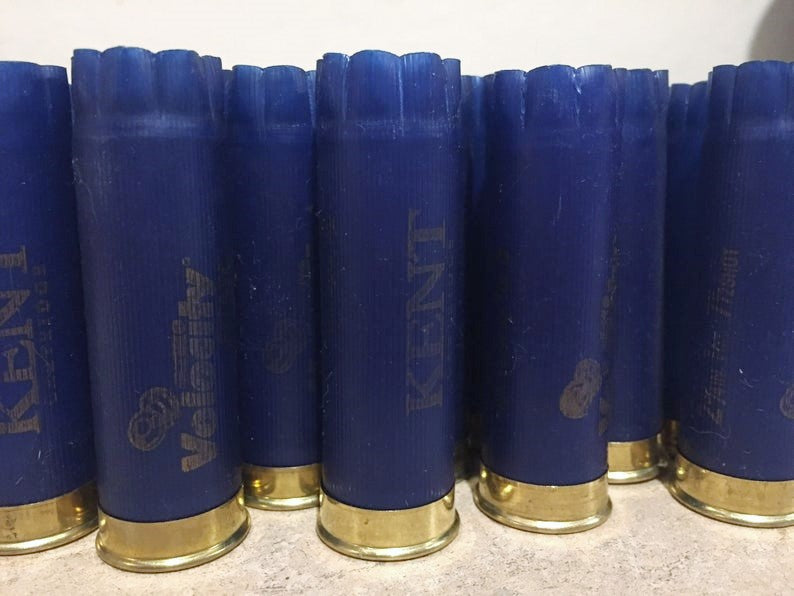 Navy blue Kent Velocity shotgun shells with gold bottoms showing fluted crimped tops