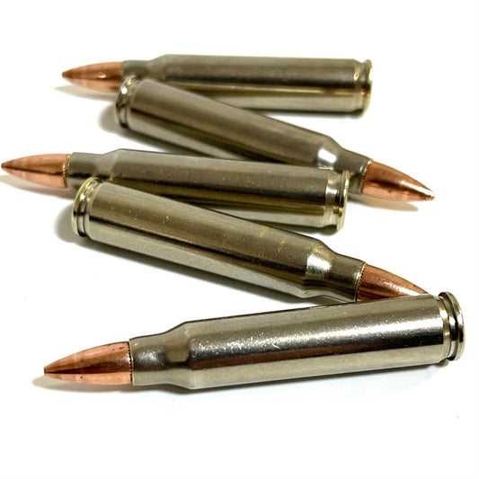 Five nickel-plated .223 dummy rifle cartridges with copper bullet tips arranged in a vertical zig-zag pattern on white.