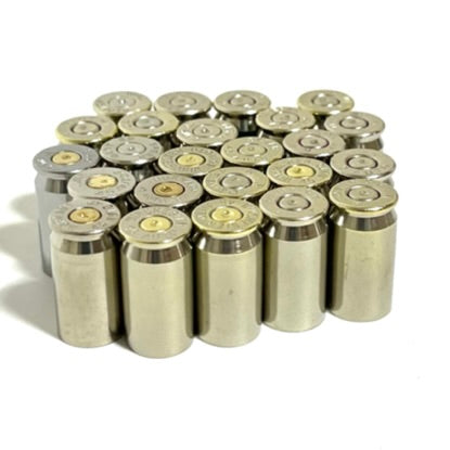 Cluster of nickel 45 ACP empty casings standing upright on a white background