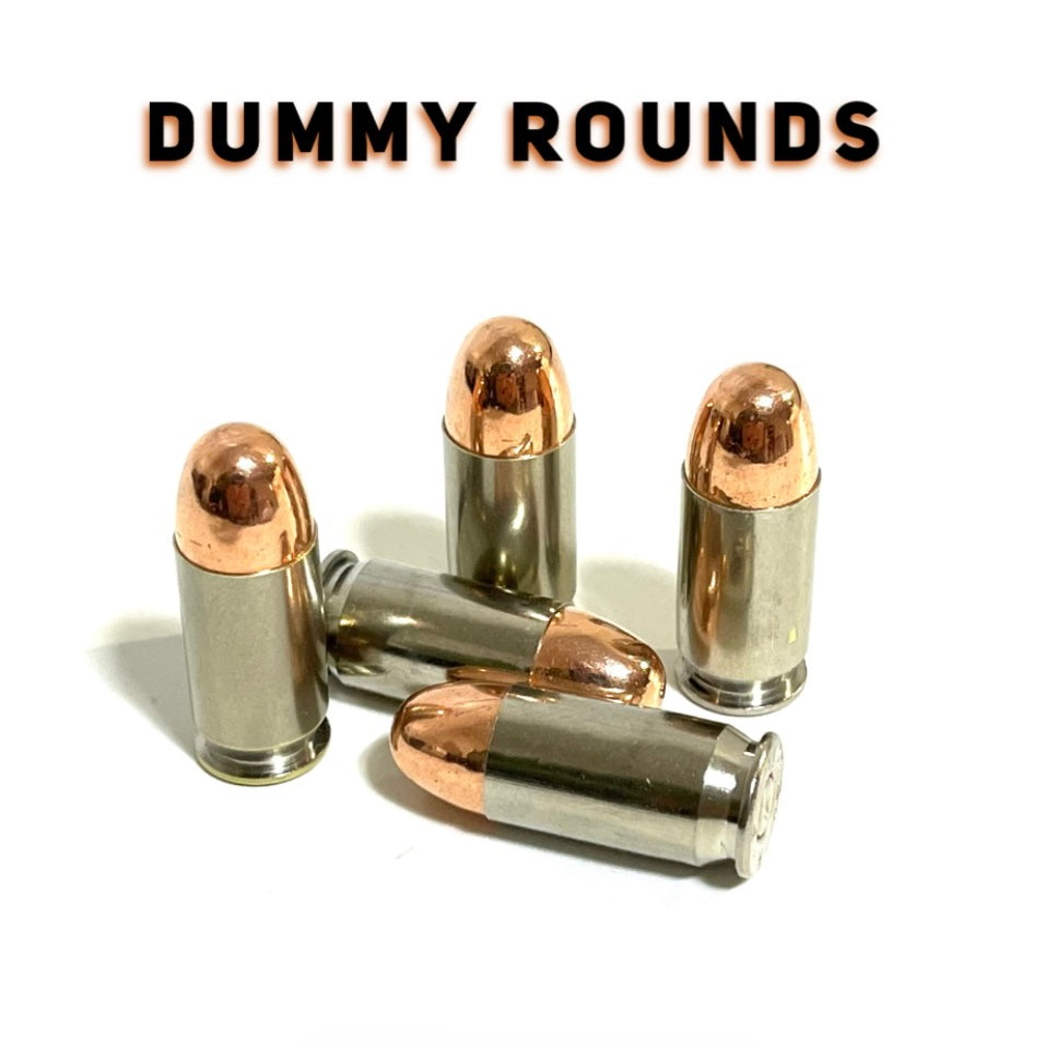 Five nickel 45 ACP dummy rounds arranged on a white background below the text DUMMY ROUNDS.