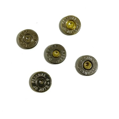 Five nickel bullet slices arranged in a circular design on a plain white background.