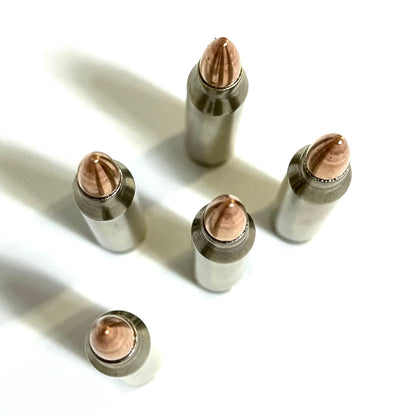 Top view of 5 nickel-plated .223 dummy rifle cartridges standing upright showing base rims and copper bullet tips.