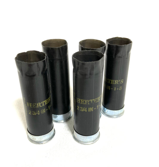 Inert Empty black 12-gauge Herter's shotgun shells with silver bases and gold lettering for DIY ammo crafting.SHIPPING