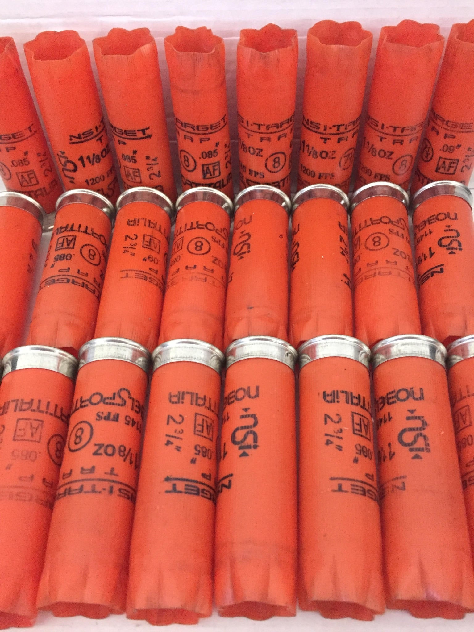 Empty 12 Gauge Orange Shotgun Shells With Silver Bottoms