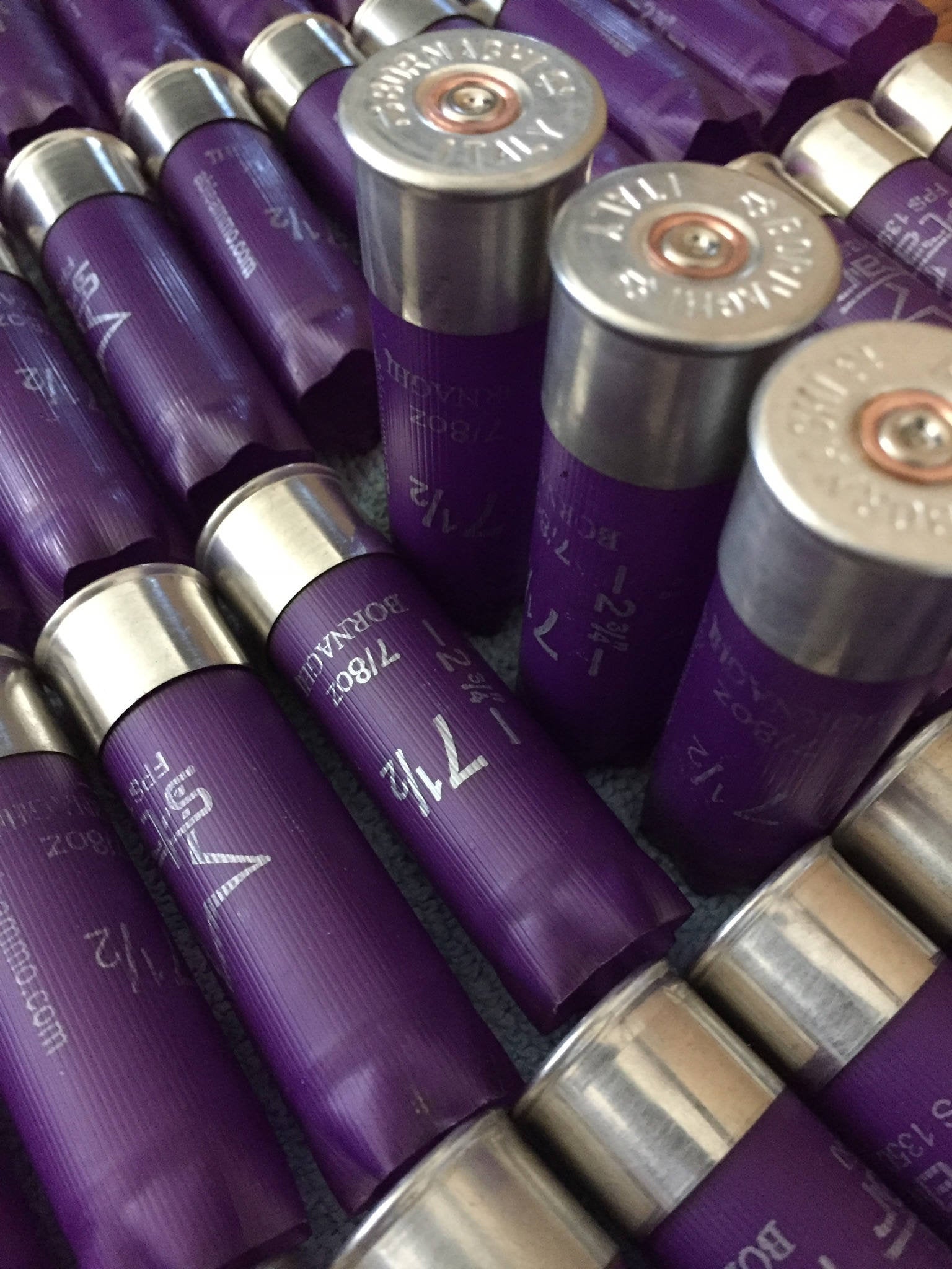 Purple Bornaghi 12 gauge shotgun shells lying in a row showing silver heads and 7 1/2 shot size text