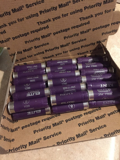 Rows of purple Kent shotgun shells packed inside a cardboard Priority Mail box