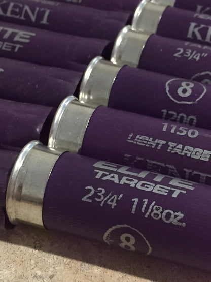 5 purple Kent shotgun shells lying diagonally showing printed text and silver heads