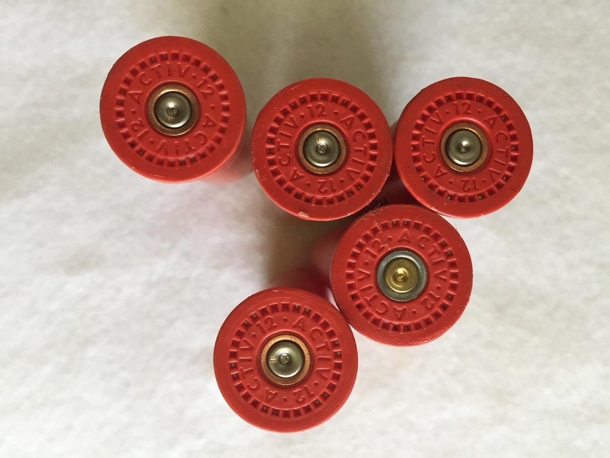 5 red plastic shotgun shell heads viewed from above embossed "Activ 12"