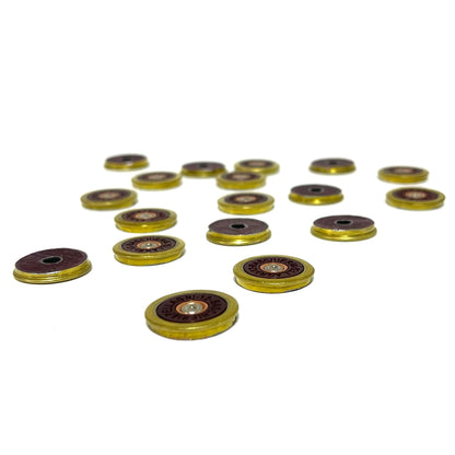 17 Baschieri and Pellagri 12 GA red shotgun shell slices with brass rims on a dark background