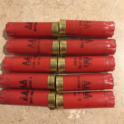 Ten Red Winchester AA 12 Gauge empty shotgun shells In Two Rows