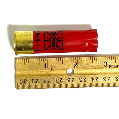 Red Winchester Super X 16 gauge shotgun shell with brass base measured against a ruler showing approximately 2.75 inches