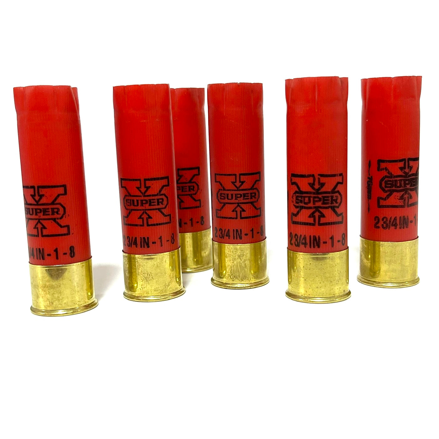Six red Winchester Super X 16 gauge shotgun shells with brass bases standing upright