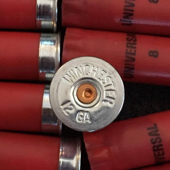 Winchester 12 Gauge Headstamp Close Up On Red Universal Hulls