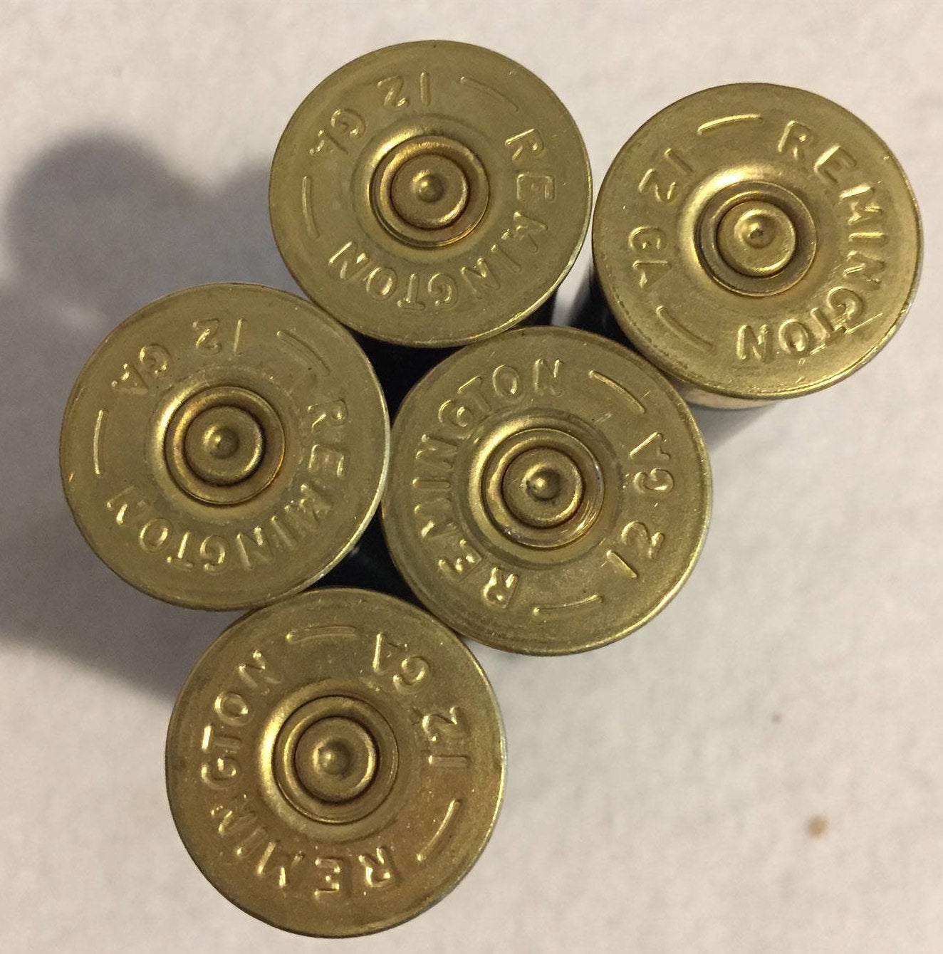 Remington 12 Gauge Headstamp Close Up On Dark Green Hulls