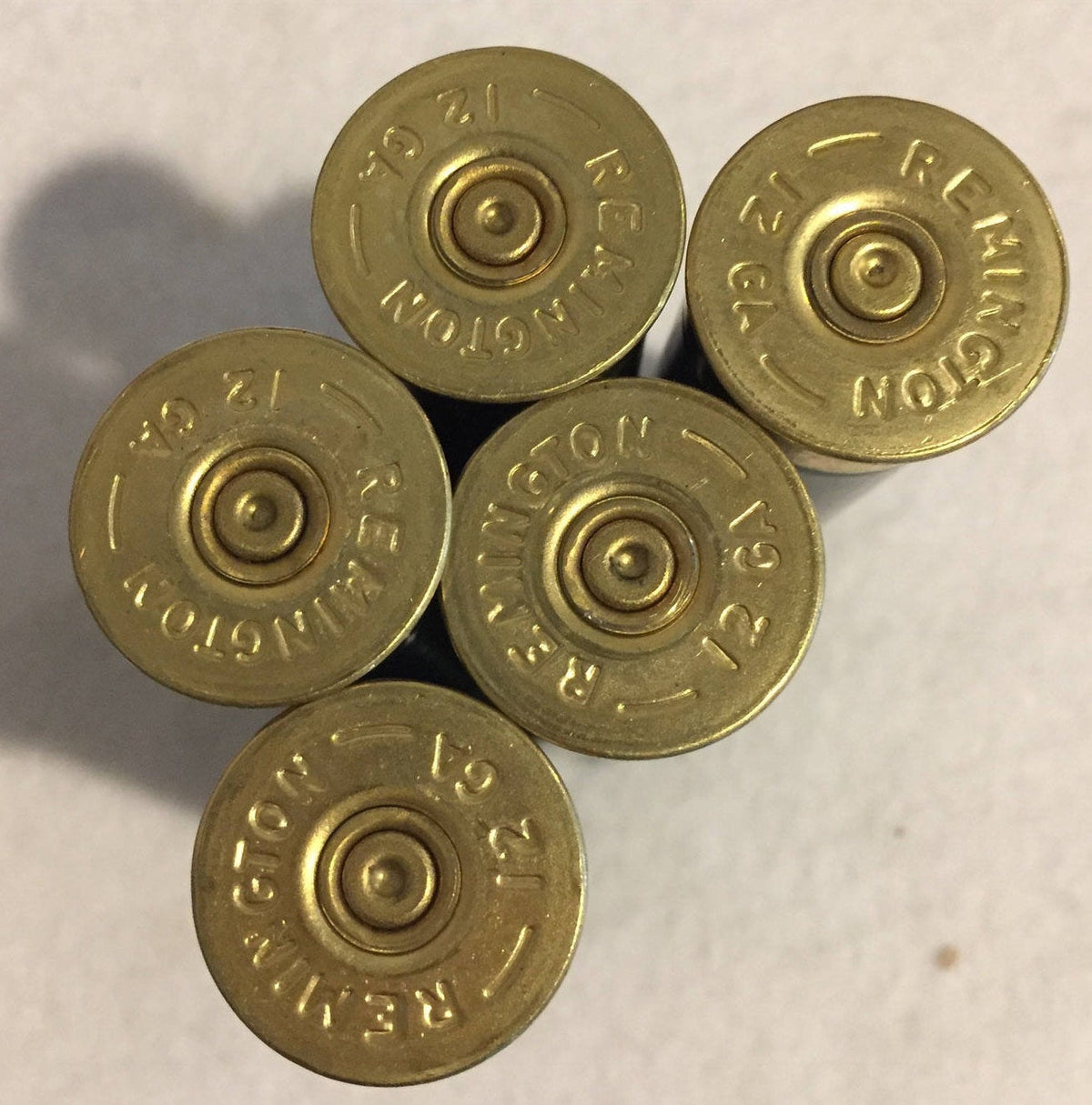 Remington 12 Gauge Headstamp Close Up On Dark Green Hulls