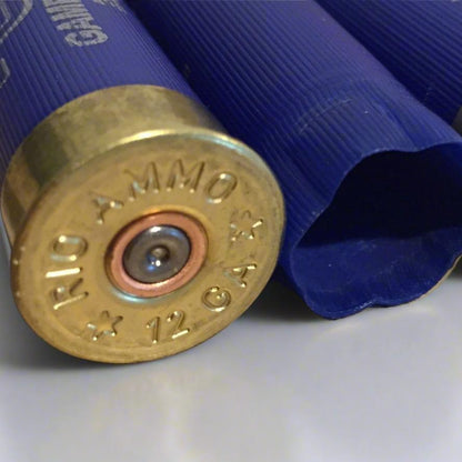 Macro shot of RIO blue 12ga spent shotgun hull brass primer bases displaying headstamp markings