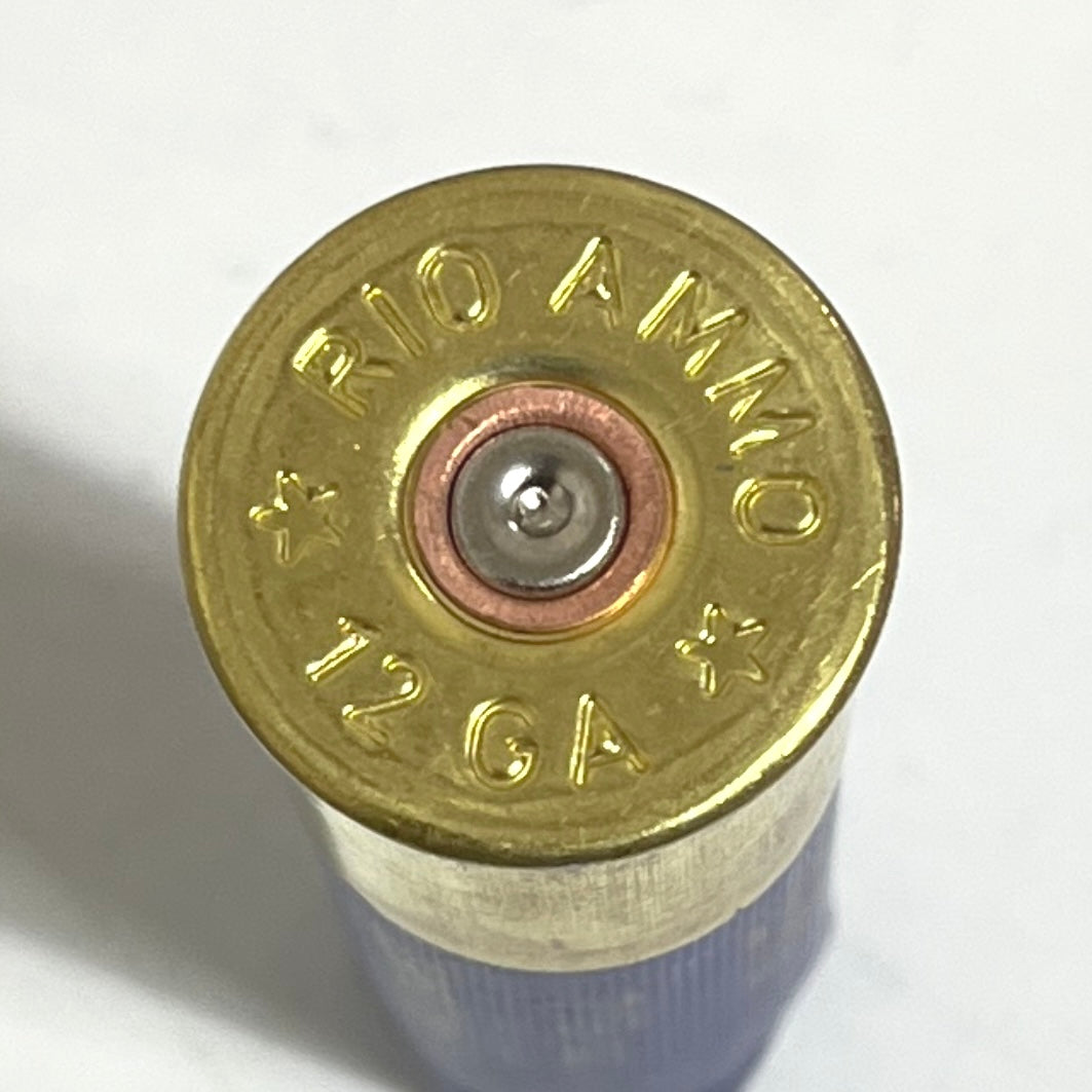 Extreme close-up of a single brass headstamp on an empty 12ga shell with Rio Ammo markings.