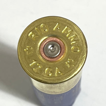 Extreme close-up of a single brass headstamp on an empty 12ga shell with Rio Ammo markings.