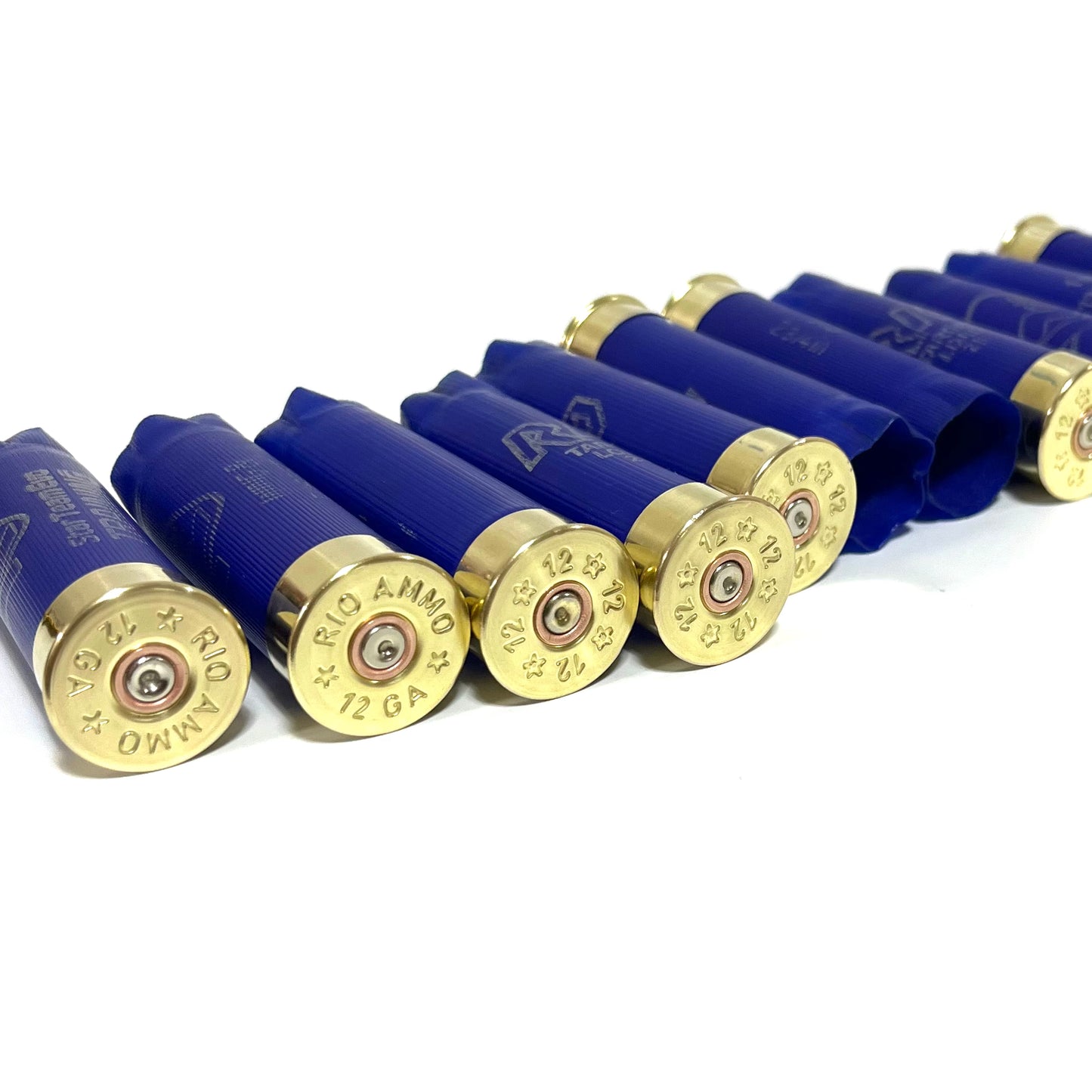 Row of blue Rio 12 gauge shotgun shell hulls at an angle showing brass "RIO Ammo 12 GA" headstamps
