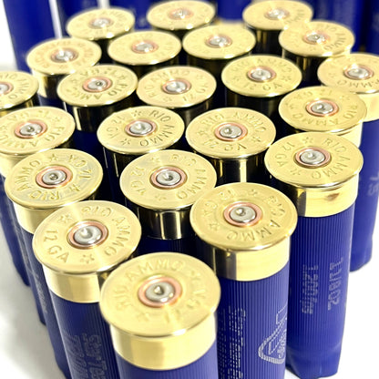 Cluster of blue Rio 12 gauge shotgun shell hulls viewed from above showing brass "RIO Ammo 12 GA" headstamps
