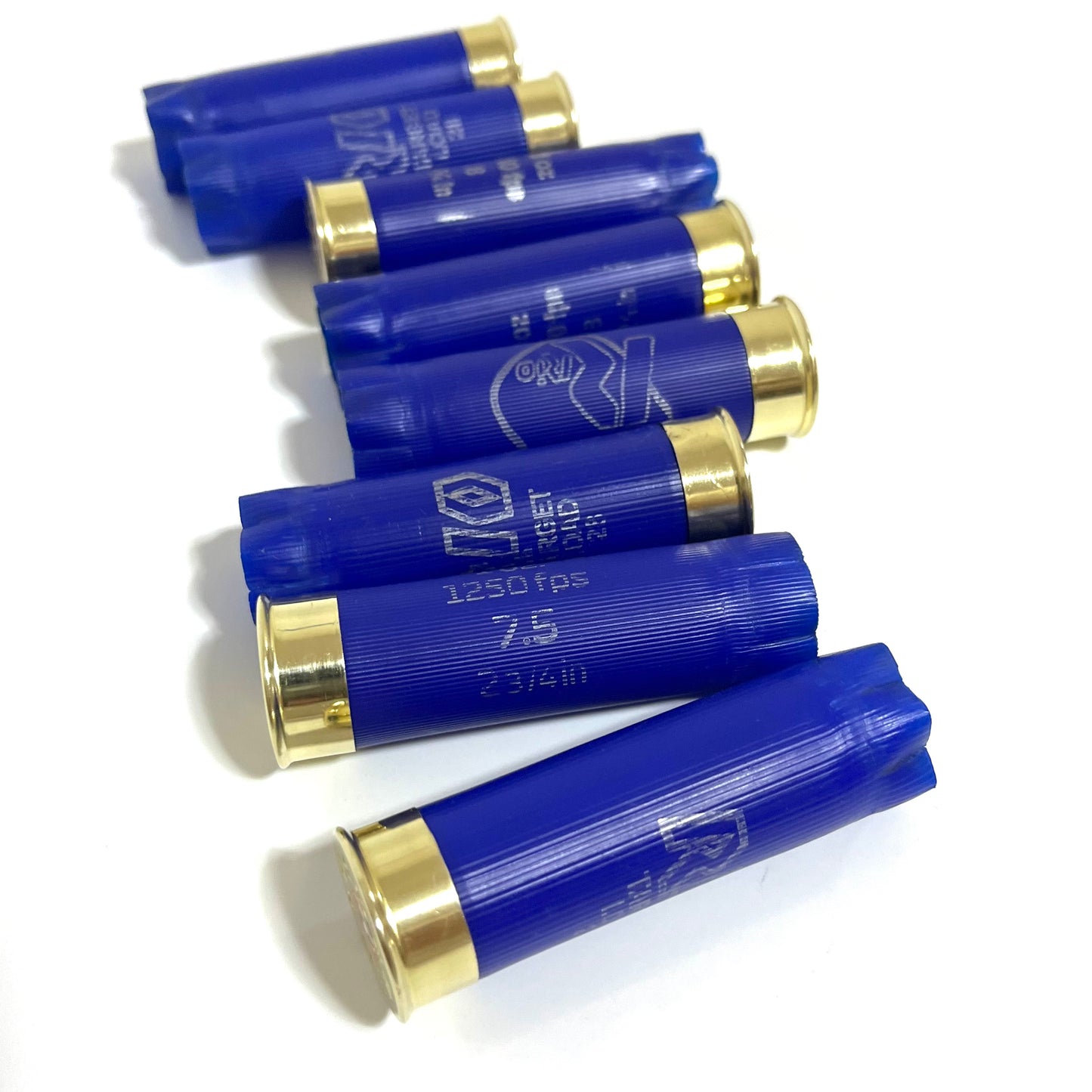 Seven blue Rio 12 gauge shotgun shell hulls on a white background showing "1250 fps 7.5 2 3/4 in" markings