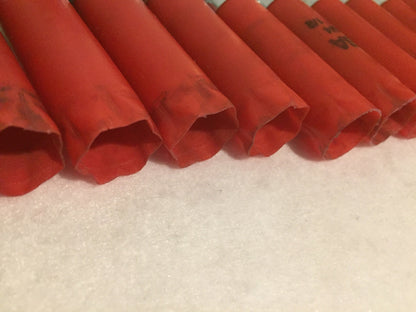 Close-up of red Winchester shotgun shells showing fluted crimped tops