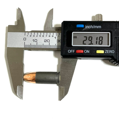 A single gray steel 9mm dummy casing with bullet, measured lengthwise reading 29.18 mm