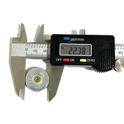 Digital caliper measuring the diameter of a Winchester 12 gauge shotgun shell slice showing 22.38 mm