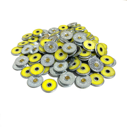 Large pile of silver Winchester 20 gauge shotgun shell slices with yellow rims showing headstamps