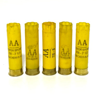 Five used yellow shells stand in a row, showing mixed Winchester AA Super Sport and Low Recoil markings.