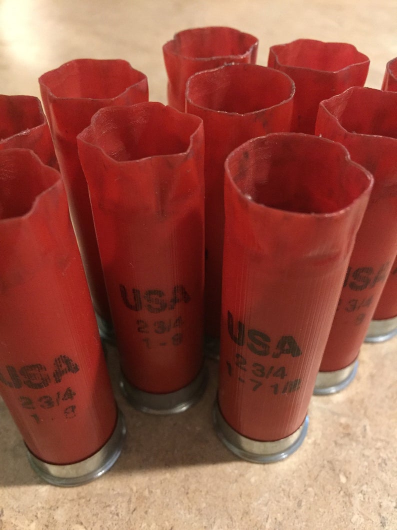 Red Winchester USA 12 gauge shotgun shells standing together showing 2 3/4 markings