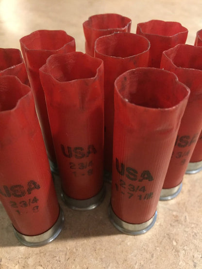 Red Winchester USA 12 gauge shotgun shells standing together showing 2 3/4 markings