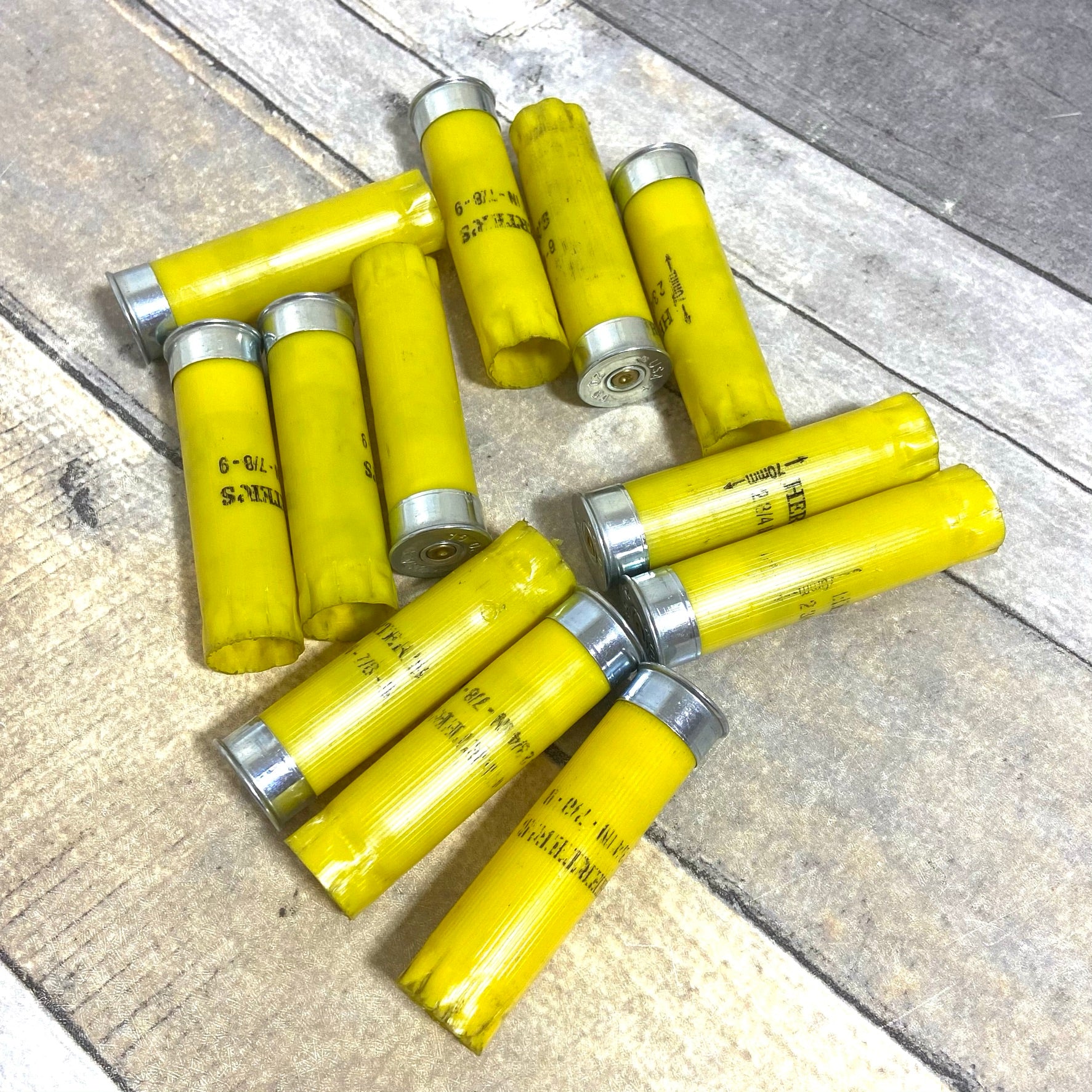 Circular arrangement of once-fired Herter's 20 gauge yellow shotgun shell hulls