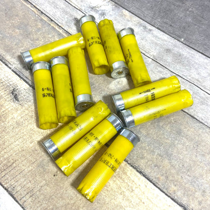Circular arrangement of once-fired Herter's 20 gauge yellow shotgun shell hulls