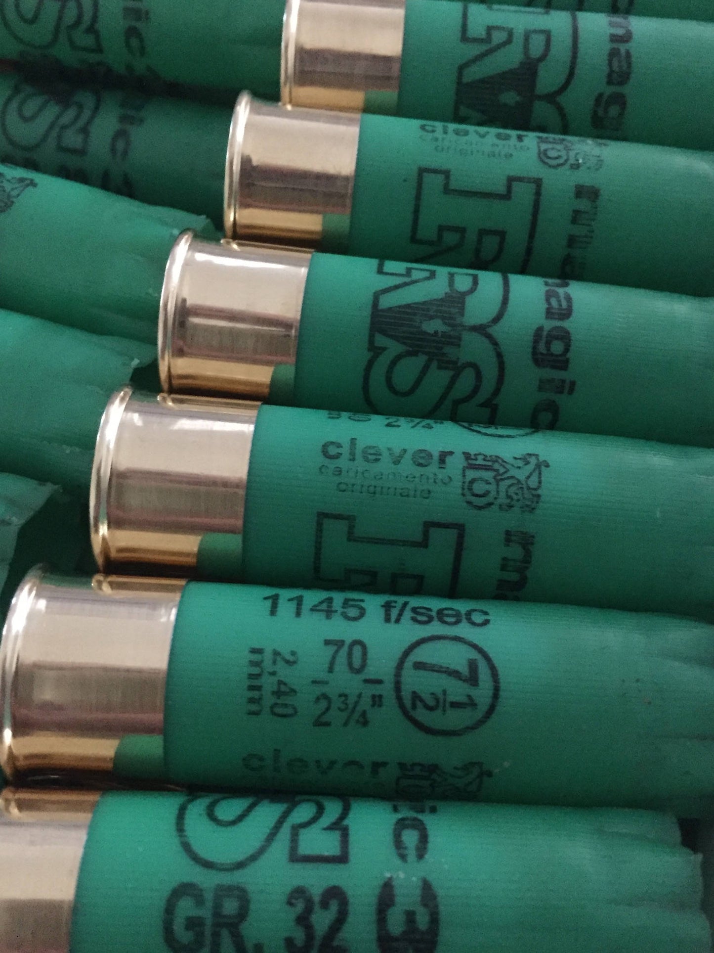 Green shotgun shells with gold bases printed "clever", "1145 f/sec", and "70mm-2¾" text