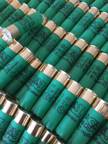 Rows of green shotgun shells with gold bases printed "SAT magic", "GR.32", and "1145 f/sec" text