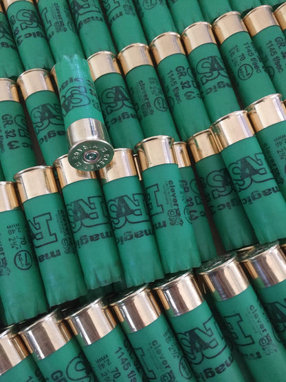 Rows of green shotgun shells with gold bases printed "SAT magic", one shell tilted showing its silver base